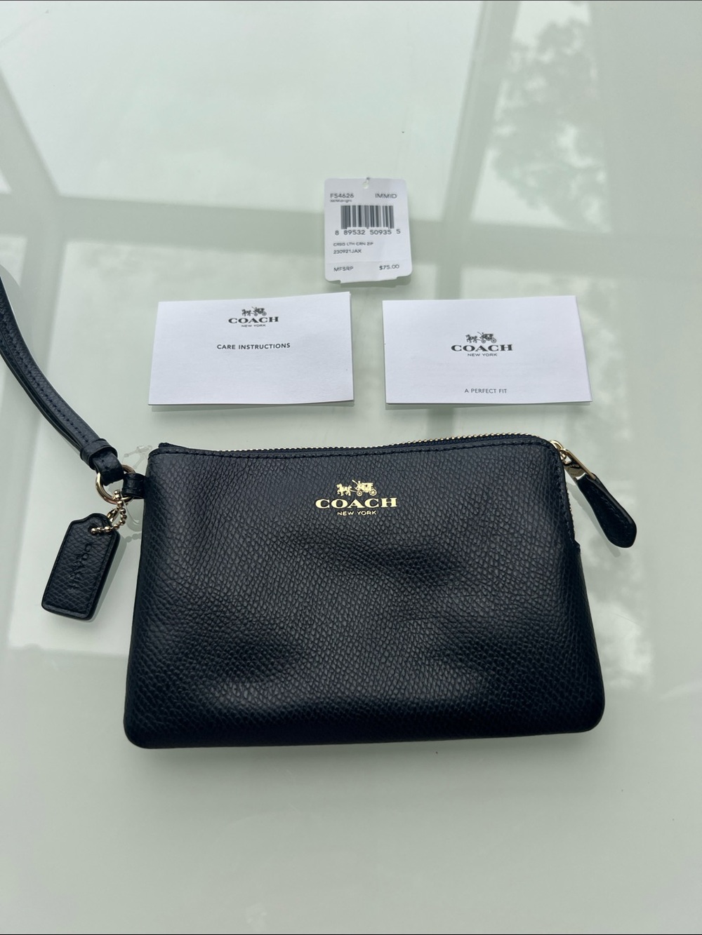 Coach “NWT”Black Pebbled Leather Wristlet with Gold Logo